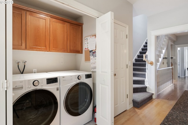 2452 NW Pettygrove St, Portland, OR 97210 - laundry room with light wood-style flooring, laundry area, and washer and clothes dryer