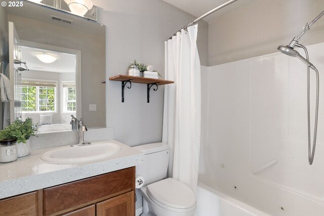 2452 NW Pettygrove St, Portland, OR 97210 - bathroom featuring visible vents, toilet, shower / bath combination with curtain, and vanity