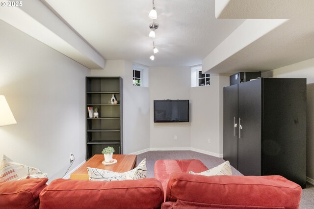 2452 NW Pettygrove St, Portland, OR 97210 - carpeted living area featuring track lighting and baseboards
