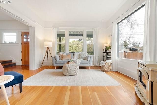 living room with stairway and hardwood / wood-style flooring