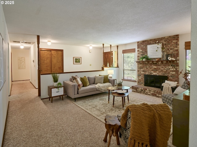 135 Ridgecrest Dr, Toledo, WA 98591 - living area featuring light colored carpet, healthy amount of natural light, a fireplace, and a textured ceiling