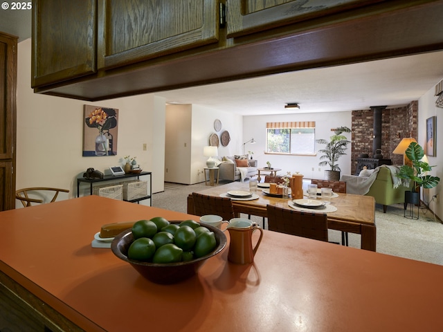 135 Ridgecrest Dr, Toledo, WA 98591 - dining space featuring light carpet and a wood stove