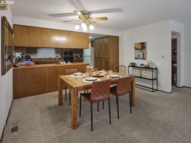 135 Ridgecrest Dr, Toledo, WA 98591 - dining room featuring light colored carpet and a ceiling fan