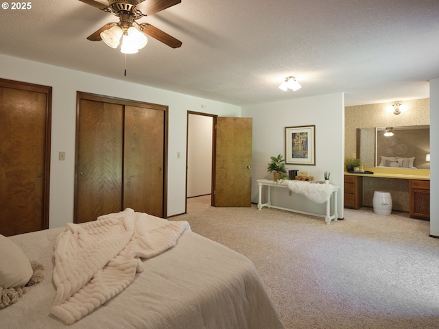 135 Ridgecrest Dr, Toledo, WA 98591 - bedroom featuring light colored carpet, two closets, ceiling fan, and a desk