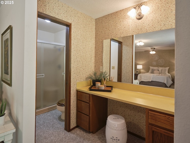 135 Ridgecrest Dr, Toledo, WA 98591 - full bathroom with toilet, a shower stall, vanity, wallpapered walls, and ceiling fan