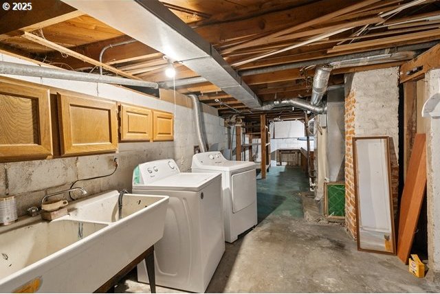 washroom with cabinet space and independent washer and dryer
