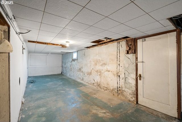 below grade area with a paneled ceiling