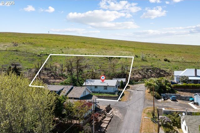 aerial view of sparsely populated area featuring property parcel outlined