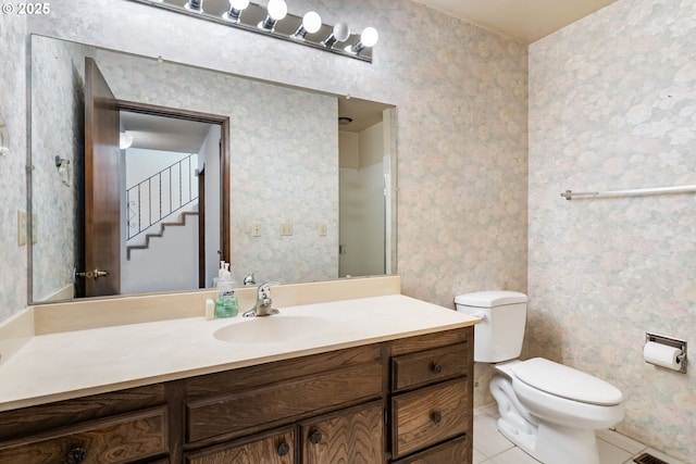 224 N Hayden Bay Dr, Portland, OR 97217 - bathroom featuring wallpapered walls, vanity, and tile patterned floors