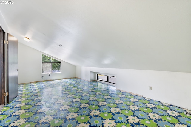 224 N Hayden Bay Dr, Portland, OR 97217 - additional living space featuring vaulted ceiling and tile patterned floors