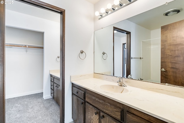 224 N Hayden Bay Dr, Portland, OR 97217 - full bathroom with vanity, a shower, and a spacious closet