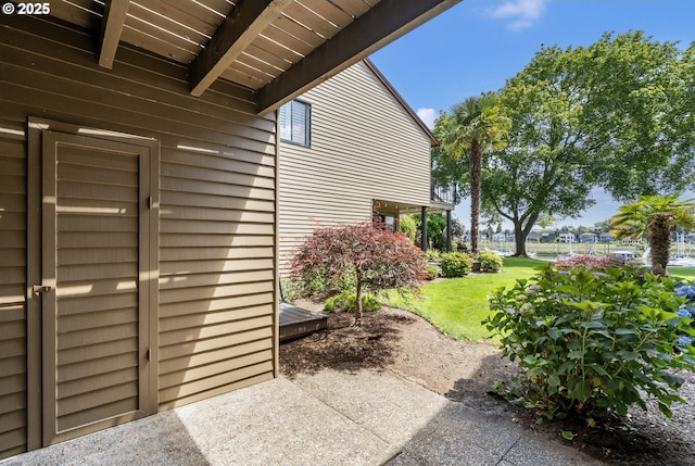 224 N Hayden Bay Dr, Portland, OR 97217 - view of property exterior featuring a lawn and a patio