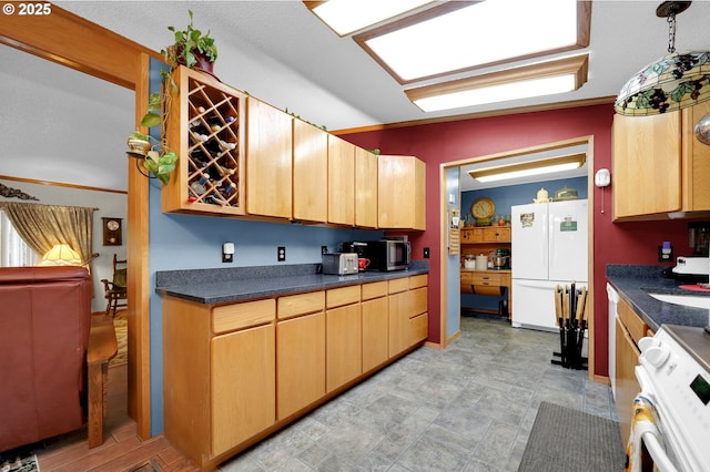 39028 Dexter Rd, Dexter, OR 97431 - kitchen with freestanding refrigerator, stainless steel microwave, range, and dark countertops