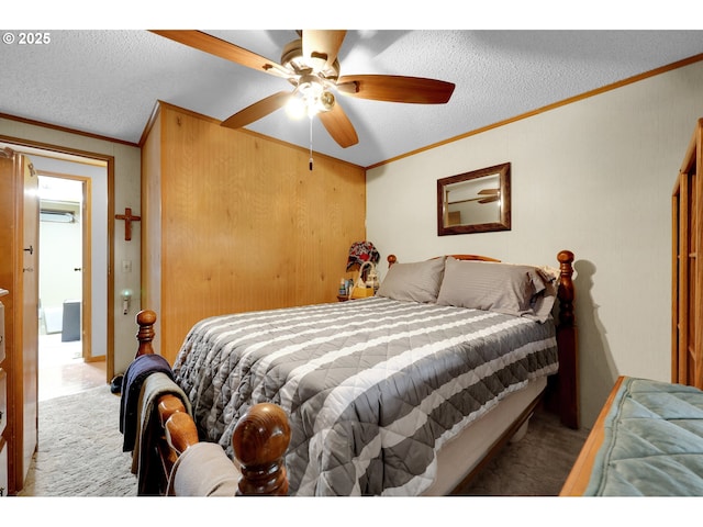 carpeted bedroom with crown molding, an AC wall unit, a textured ceiling, a ceiling fan, and a closet