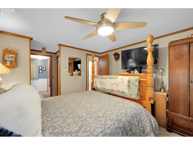 bedroom with carpet flooring, a textured ceiling, ceiling fan, and ornamental molding