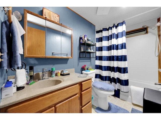 full bathroom with vanity, tile patterned flooring, shower / bath combo with shower curtain, and toilet