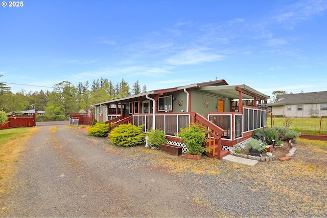 39028 Dexter Rd, Dexter, OR 97431 - manufactured / mobile home with a porch and fence