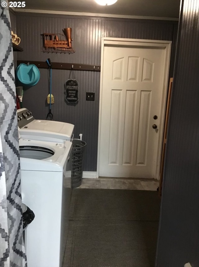clothes washing area featuring washer and dryer and laundry area