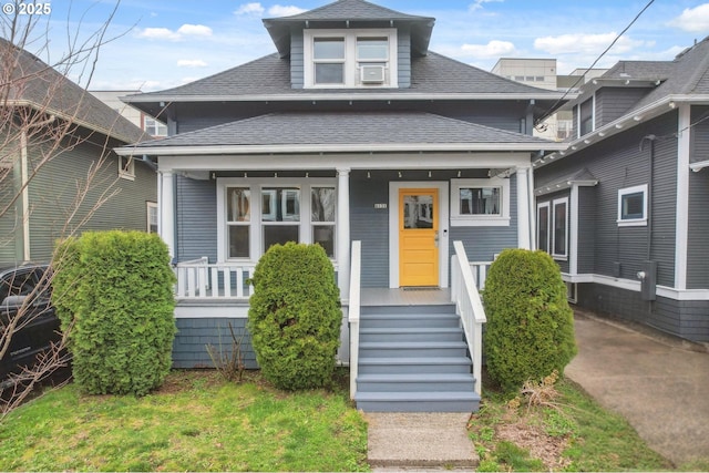 4131 NE Cleveland Ave, Portland, OR 97211 - view of front of house featuring a porch and roof with shingles