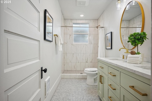 bathroom with tile patterned flooring, vanity, toilet, a shower stall, and visible vents
