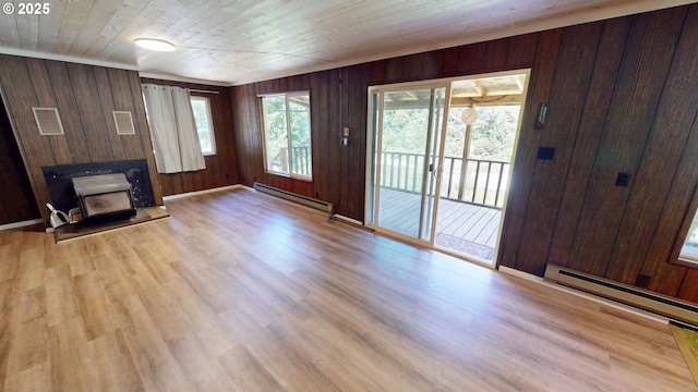 33080 Lupine Way Rd, Gold Beach, OR 97444 - unfurnished living room featuring a baseboard radiator, wooden walls, wood finished floors, and wooden ceiling