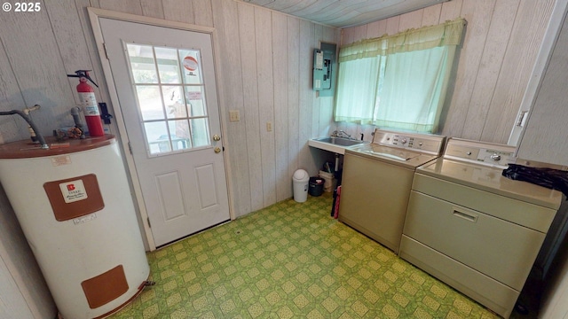 33080 Lupine Way Rd, Gold Beach, OR 97444 - laundry area featuring water heater, wood walls, light flooring, independent washer and dryer, and electric panel