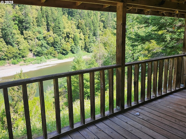 33080 Lupine Way Rd, Gold Beach, OR 97444 - wooden deck featuring a forest view and a water view