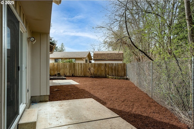 view of yard featuring a fenced backyard and a patio area