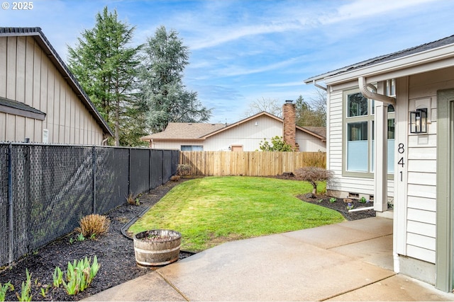 view of yard featuring a patio area and a fenced backyard