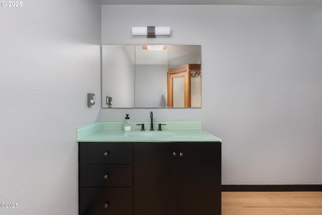 3109 NW Neptune Ave, Lincoln City, OR 97367 - bathroom featuring vanity and wood finished floors
