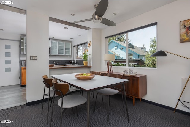 3109 NW Neptune Ave, Lincoln City, OR 97367 - carpeted dining area with a ceiling fan and baseboards