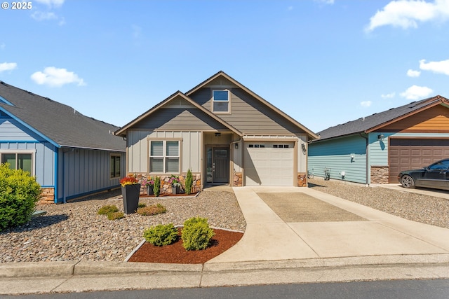 craftsman inspired home featuring stone siding, board and batten siding, concrete driveway, and an attached garage