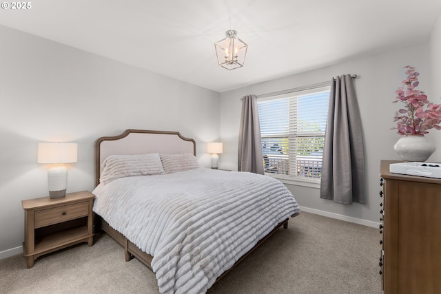 521 Wildcat Canyon Rd, Sutherlin, OR 97479 - bedroom featuring light colored carpet, baseboards, and a chandelier