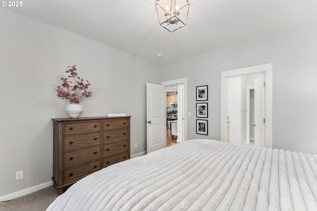 521 Wildcat Canyon Rd, Sutherlin, OR 97479 - bedroom with baseboards, a chandelier, and carpet