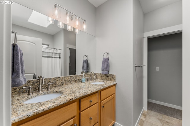 521 Wildcat Canyon Rd, Sutherlin, OR 97479 - bathroom with double vanity and baseboards