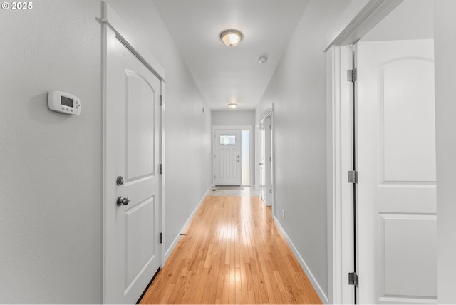 521 Wildcat Canyon Rd, Sutherlin, OR 97479 - corridor featuring light wood finished floors and baseboards