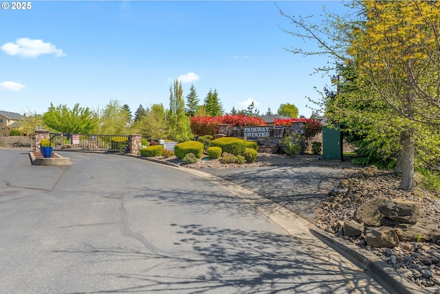 521 Wildcat Canyon Rd, Sutherlin, OR 97479 - view of asphalt street featuring curbs, a gate, and a gated entry