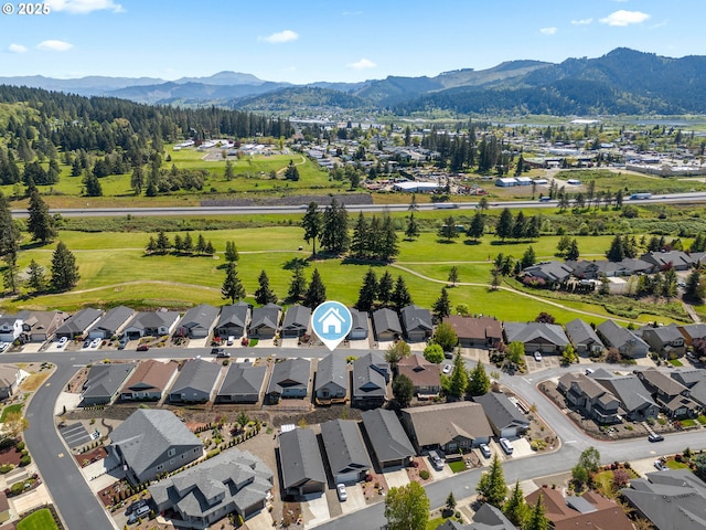 521 Wildcat Canyon Rd, Sutherlin, OR 97479 - aerial perspective of suburban area featuring a mountainous background