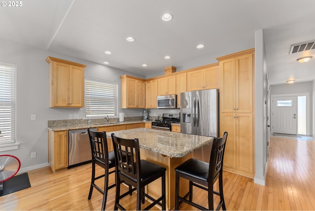 521 Wildcat Canyon Rd, Sutherlin, OR 97479 - kitchen featuring stainless steel appliances, light brown cabinetry, light wood-type flooring, baseboards, and recessed lighting