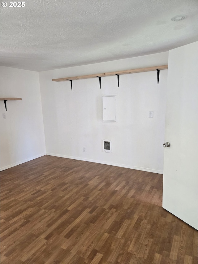 1625 Jackson St, Albany, OR 97322 - empty room featuring wood finished floors, electric panel, and a textured ceiling