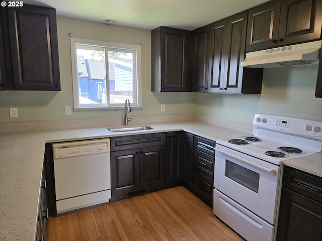1625 Jackson St, Albany, OR 97322 - kitchen with white appliances, under cabinet range hood, light countertops, and light wood-style flooring