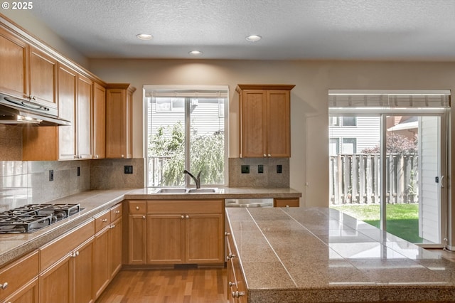 13605 NW Hogan St, Portland, OR 97229 - kitchen featuring a sink, gas cooktop, tile countertops, recessed lighting, and a textured ceiling