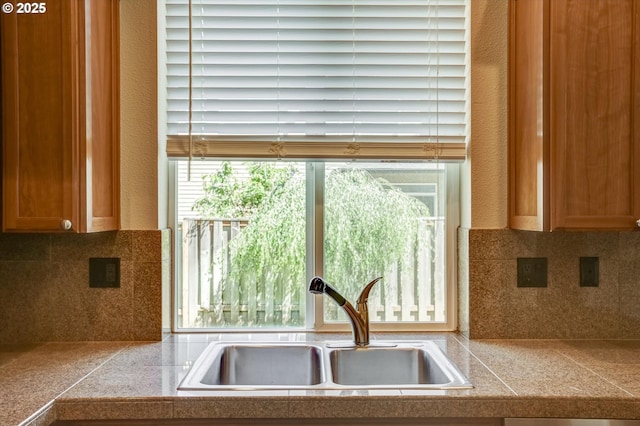 13605 NW Hogan St, Portland, OR 97229 - kitchen with a sink, tile countertops, and backsplash