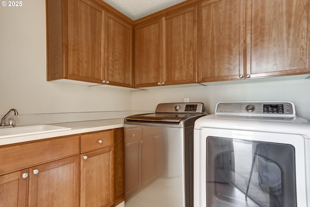13605 NW Hogan St, Portland, OR 97229 - laundry room featuring cabinet space and washer and clothes dryer