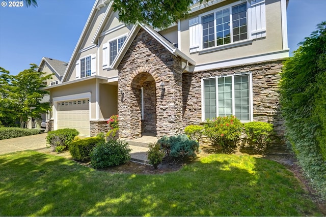13605 NW Hogan St, Portland, OR 97229 - view of front of house with stone siding, stucco siding, an attached garage, and a front lawn