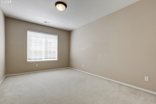 13605 NW Hogan St, Portland, OR 97229 - spare room with carpet floors, baseboards, and a textured ceiling