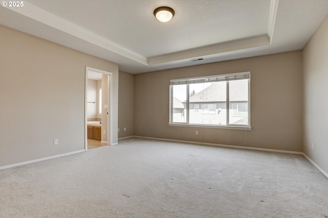 13605 NW Hogan St, Portland, OR 97229 - unfurnished room featuring a tray ceiling, carpet, a textured ceiling, and baseboards
