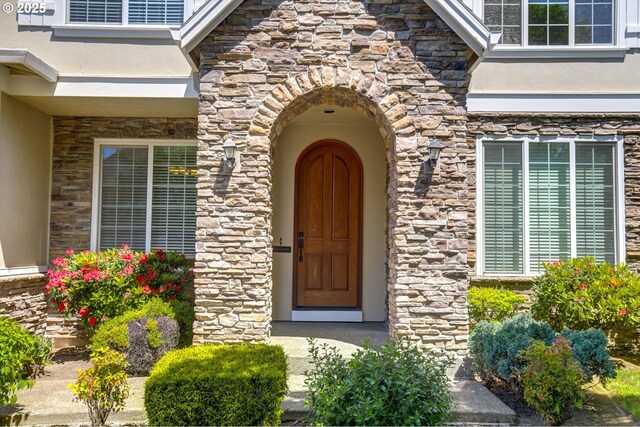 13605 NW Hogan St, Portland, OR 97229 - view of exterior entry featuring stone siding and stucco siding