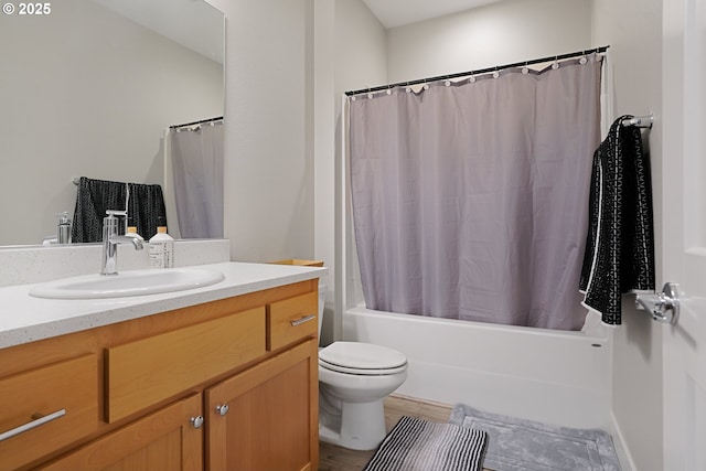 full bath with toilet, shower / bath combo with shower curtain, wood finished floors, and vanity