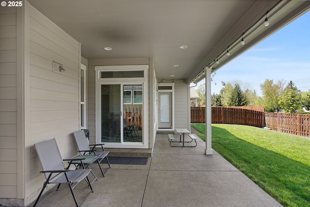 view of patio / terrace featuring fence